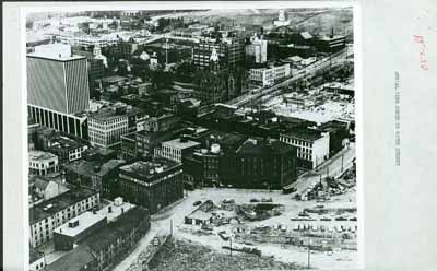 Historic image of an aerial view over the Halifax Waterfront Buildings emphasizing the spatial relationship of the buildings to each other and to the harbour. © Parks Canada Agency / Agence Parcs Canada, n.d.
