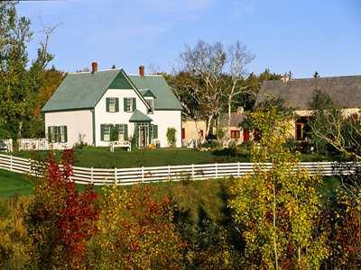 General view of L.M. Montgomery's Cavendish, showing its setting among wooded groves, pathways and rolling agricultural fields. © Parks Canada Agency / Agence Parcs Canada.