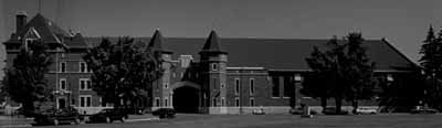 Front view of the Salaberry Armoury, showing the building’s two and three storey massing, the stepped profile, monumental scale and proportions, 1898. © Parks Canada Agency / Agence Parcs Canada, Henri Langlois, 1989.