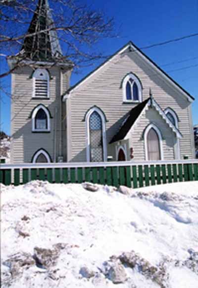 View of the façade of Christ Church / Quidi Vidi Church, showing its Gothic Revival style, including its square side tower, capped by a spire, 1994. © Parks Canada Agency / Agence Parcs Canada, J. Butterill, 1994.