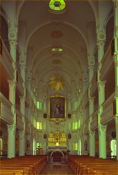 Central view of the interior of the Bon-Pasteur Chapel, 1980. © Parks Canada Agency/ Agence Parcs Canada, 1980.