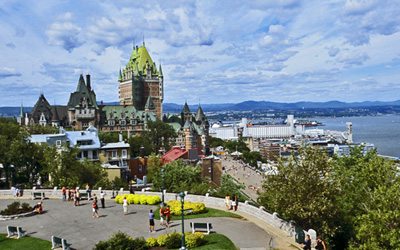 General view of Château Frontenac showing its prominent location and imposing presence on a cliff, overlooking the St. Lawrence River. © Parks Canada Agency / Agence Parcs Canada.