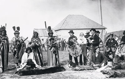 Photo by O.B. Buell showing Mistahi-maskwa (Big Bear) trading at Fort Pitt, 1884. © Library and Archives Canada / Bibliothèque et Archives Canada, PA-118768