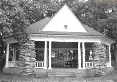 Front elevation of the Gordon Island Pavilion, showing the the two massive rubble stone pillars that flank the front entrance and the the large dormer gables, 1992. © Archeological Services and Historic Resources Ltd., 1992.