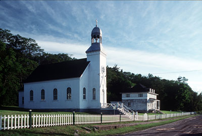 General view of Building 48, showing the massing that consists of the small chapel with a pitched roof and the attached bell tower porch, circa 2004. (© Parks Canada Agency / Agence Parcs Canada, circa / vers 2004.)