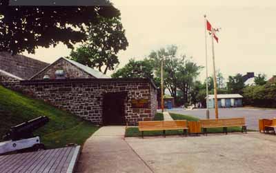 View of the main entrance of the Esplanade Powder Magazine, showing gable roof, 1989. © Parks Canada Agency / Agence Parcs Canada, 1989.