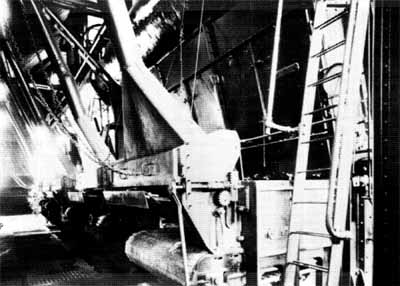 Interior view of the Ottawa Electric Railway Company Steam Plant, showing the former automatic stokers and boilers in the boiler room. © COA, OER Collection, CA-15030