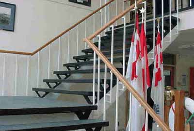 Interior view of the Former Pickering Town Hall, showing details such as the wood wainscoting and tin-embossed paneling, 2005. © Public Works and Government Services Canada / Travaux publics et Services gouvernementaux Canada, 2005.