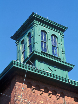 Detail view of Gooderham and Worts Distillery showing coordinated palette of material and paint colours throughout. © Parks Canada Agency / Agence Parcs Canada.