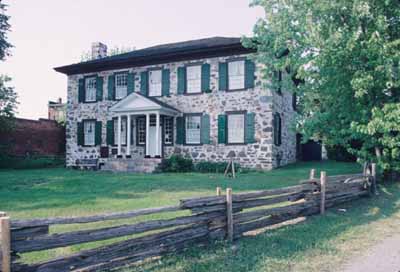 Corner view of the Ermatinger House, showing the façade and a side, 1995. © Parks Canada Agency/ Agence Parcs Canada, 1995.