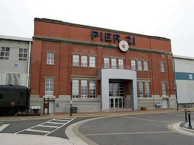 General view of Pier 21, showing the scale, linear form and two-storey massing with industrially designed shed attached to more formally finished central office bay, 2010. © Pier 21, Jennyrotten, 2010.