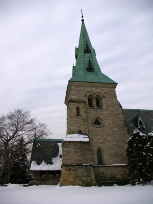 General view of Chapel of St. James-the-Less, showing its materials, including Georgetown grey sandstone, white brick, Ohio stone trim, slate roofing, and wooden porch, 2007. © Chapel of St. James-the-Less, Michael Kooiman, February 2007.