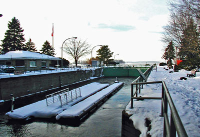 General view of Sainte-Anne-de-Bellevue, showing the form, surviving original materials and functioning technology of the stone masonry lock, 2003. © Parks Canada Agency / Agence Parcs Canada, 2003.