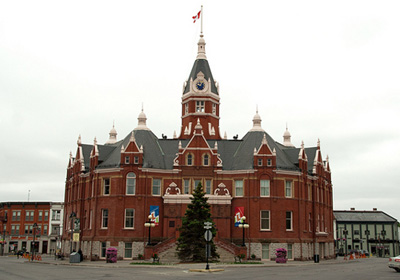 General view of Stratford City Hall, showing its siting on an irregular, triangular-shaped site, and its central location, 2011. © Stratford City Hall, Perry Quan, 2011.
