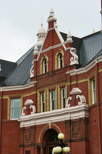 General view of Stratford City Hall, showing its use of a variety of materials, colours, shapes and textures, in keeping with the stylistic eclecticism, 2011. © Stratford City Hall, Corey Seeman, 2011.