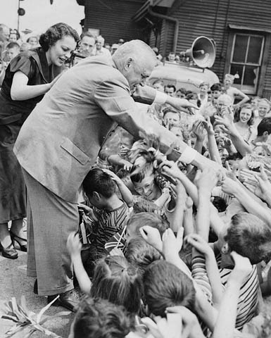 Prime Minister Louis St. Laurent with children, probably during election campaign. © Library and Archives Canada/PA-123988