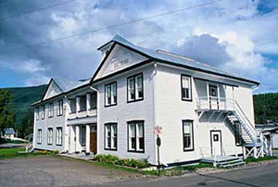 General view of the Former Territorial Court House, showing its wood-frame construction adapted to cope with permafrost and fine finishing details, all evocative of high standards of craftsmanship, 1995. © Parks Canada Agency / Agence Parcs Canada, W. Lynch, 1995.