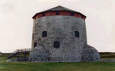 Exterior view of the Martello tower located at Point Frederick Buildings National Historic Site of Canada, 1993. © Department of National Defence / Ministère de la Défense nationale, 1993.