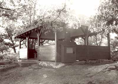 View of the exterior of the Adelaide Island Picnic Shelter, showing the open design and unpartitioned interior space, 1992. © Parks Canada Agency / Agence Parcs Canada / Historica Resources Ltd., 1992.