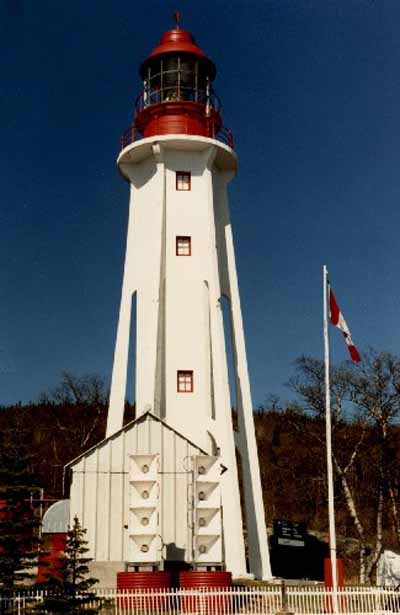 General view of the Light Tower, showing the tower's six flying buttresses, 1987. (© Canadian Coast Guard / Garde côtière canadienne, 1987.)