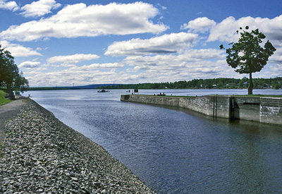 General view of Carillon Canal, showing the canal route leading to the present lock. © Parks Canada Agency / Agence Parcs Canada.