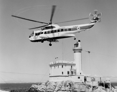 Historic photograph of Triple Islands Lighthouse, 1967. © Library and Archives Canada, Department of Transport | Bibliothèque et Archives Canada, Ministère des Transports, e008128980