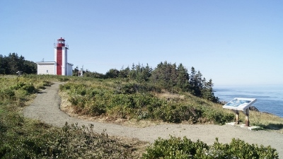 View of Prim Point Lighthouse showing its square reinforced-concrete tower attached to the single-storey concrete block fog alarm building. © Robert Hersey