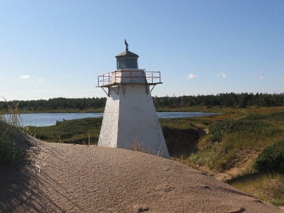 General view of St. Peters Harbour Lighthouse located among the dunes overlooking St. Peters Bay © Cy O'Quinn