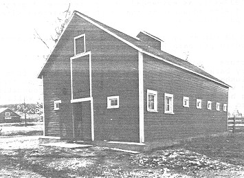 General view of the Dairy Barn, showing the front and side façades, 1992. (© Department of Public Works, AES, PC, WRO / Ministère des Travaux publics, SAG, PC, BRO, 1992.)