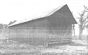 General view of the Hay Shed, showing the east and south façades, 1992. (© Department of Public Works, AES, PC, WRO / Ministère des Travaux publics, SAG, PC, BRO, 1992.)