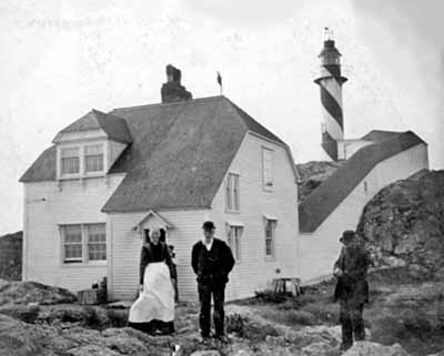 General view of the Bacalhao Island Lighttower,showing as well the keeper's house which was moved from this station in 1965, 1900. © Department of Fisheries & Oceans Canada/Département de pêches et océans Canada, 1900.