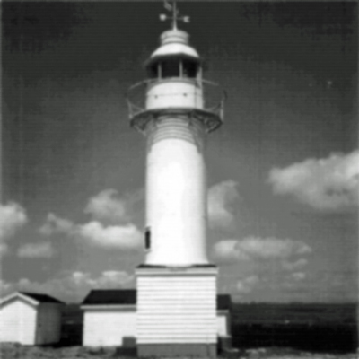General view of the Channel Head Lighttower, showing the smooth surface of the tower as a result of the segments being bolted together on the inside of the structure, 1987. © Canadian Coast Guard/Garde côtière canadienne, 1987.