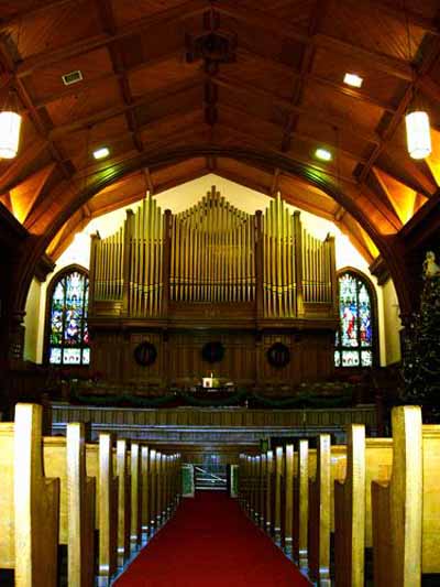 Joseph Casavant "The Casavant pipe organ serves as a backdrop for regular services at First Moncton United Baptist Church. Moncton Museum (© Expired)