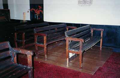 Interior view of Little Dutch (Deutsch) Church, showing its simple wooden furnishings, 1996. © Anne West, 1996.