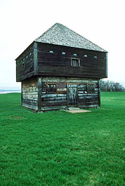 General view of Fort Edward showing its articulation as a defensive structure with sparse door and window openings and plentiful gun slits, its surviving original materials and craftsmanship, 1991. © Parks Canada Agency / Agence Parcs Canada, J. P. Jérôme, 1991.