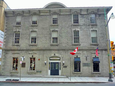 General view of the main facade of the Former Geological Survey of Canada Building emphasizing the simple Italianate detailing, including bracketed eaves, and cornices, 2011. © Parks Canada | Parcs Canada, M. Therrien, 2011.