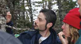 Craig Benoit of Miawpukek First Nation explains the defining features of Boreal Felt Lichen to Terra Nova National Park of Canada staff Janet Feltham and Prince Edward Island National Park of Canada staff Kirby Tulk