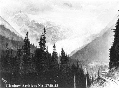 Historic image of railway line, mountains and Glacier House