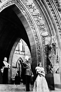 H.M. King George VI and Queen Elizabeth leaving the Parliament Buildings after giving Royal Assent to Bills in the Senate Chamber; Rt. Hon. W.L. Mackenzie King in the background, 1939.