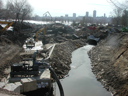 A look at the extensive construction site of Cartier-Brébeuf park in the winter, with the city in the background.