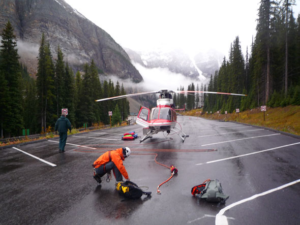 A Parks Canada Mountain Safety Specialist prepares for a helicopter rescue