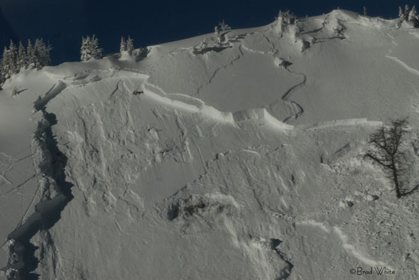 A slab avalanche leaves behind a pronounced fracture line.