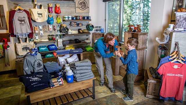  Visitors shop for Parks Canada merchandise in the Parks Canada gift shot in the Visitor Centre in Waskesiu in Prince Alberta National Park.