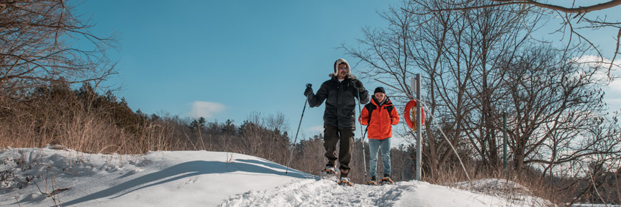 Visitors snowshoeing at Rouge National Urban Park.