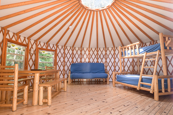 Bunk bed, futon and table in a yurt at Fundy National Park.